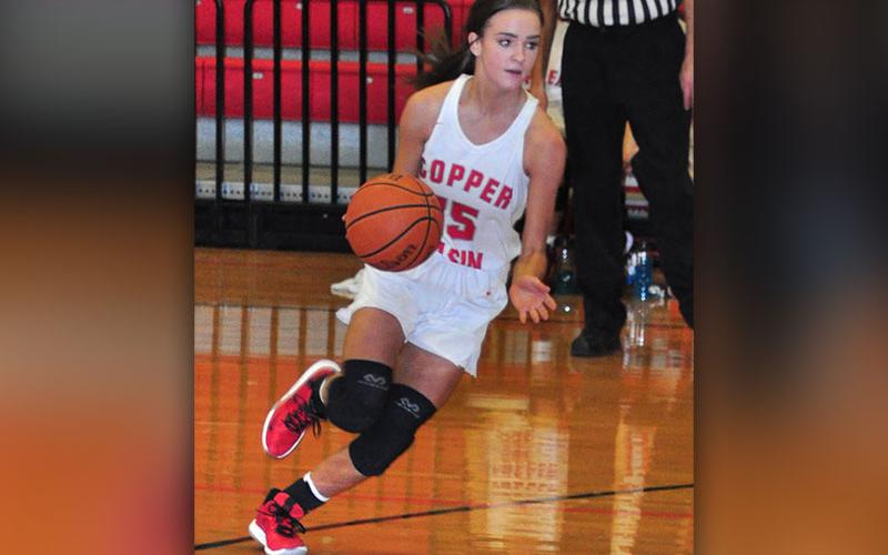 Lady Cougar Riley Smith drives toward the basket in recent action for Copper Basin.