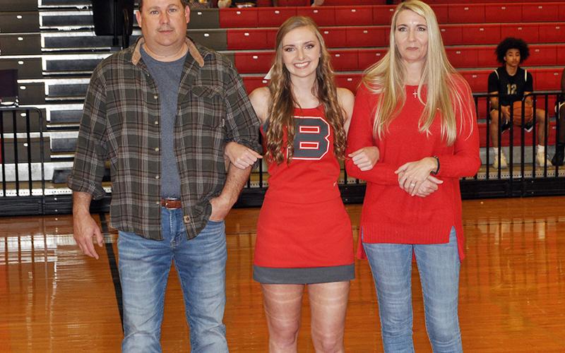 CBHS senior cheerleader Regan Holder was honored in between Copper Basin’s varsity basketball games Tuesday, February 18. Holder is shown with her parents John and Bobbi Holder.