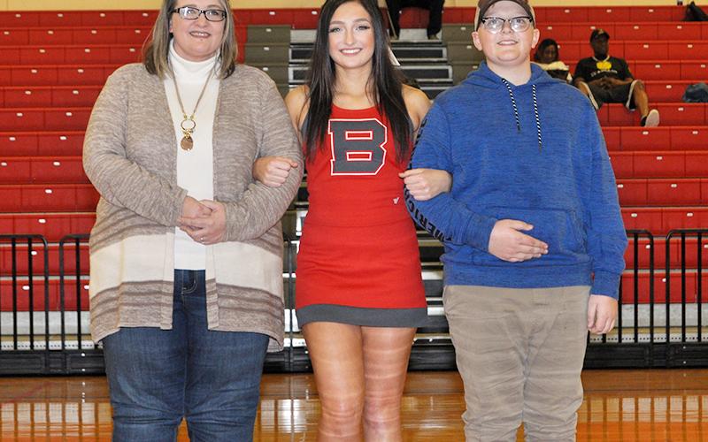 Copper Basin cheerleader Anna West was honored in between the Lady Cougars and Cougars basketball games Tuesday, February 18. West is shown with her mother ,Amanda West and brother, Zeb West.