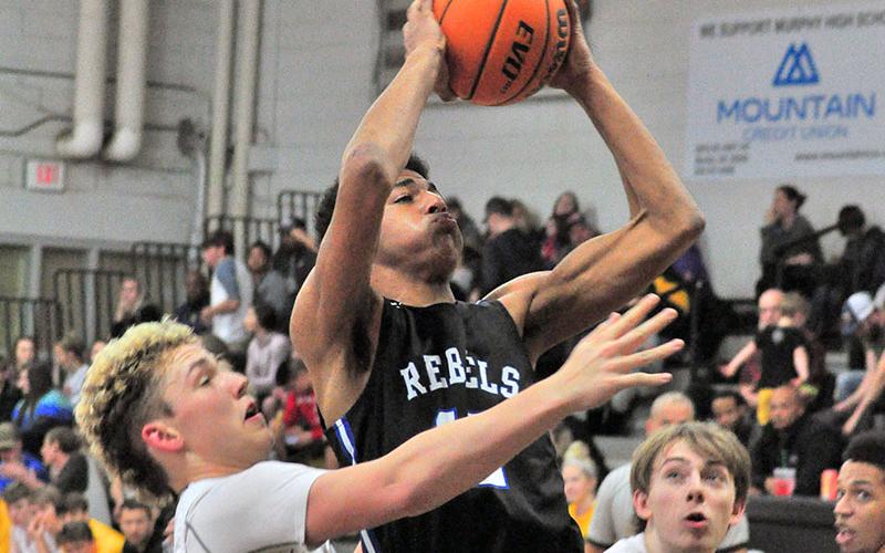 Fannin Rebel Jalen Ingram fights through contact for a two-point jumper during the Rebels’ win over Murphy Saturday, February 1. Ingram played a key role in bringing the Rebels back for the victory.