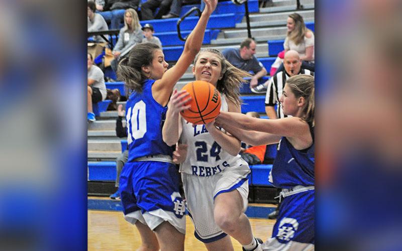 Fannin Lady Rebel Abby Ledford fights through contact for a basket in recent action for the Fannin County Lady Rebels basketball team.