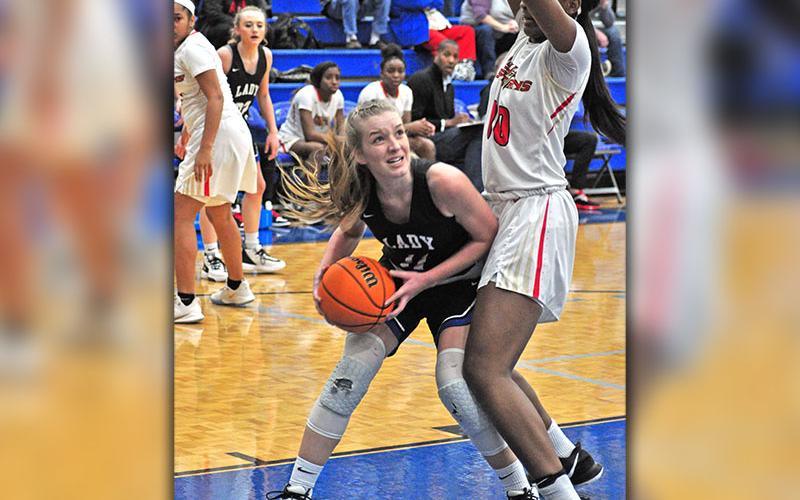 Lady Rebel Saidee Collins fights through contact in the paint for a score in recent action for Fannin County.