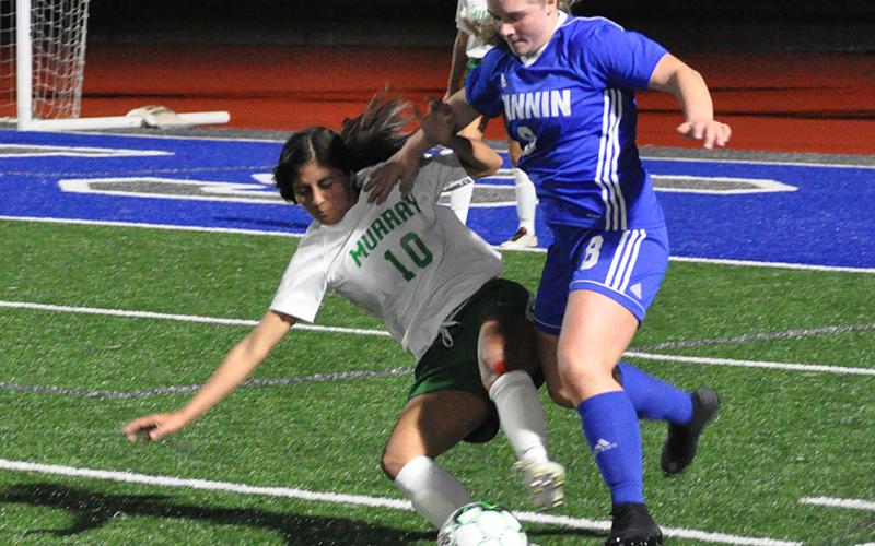 Lady Rebel Sarah Sosebee fights for the ball in recent action for the Fannin County Lady Rebels soccer team.