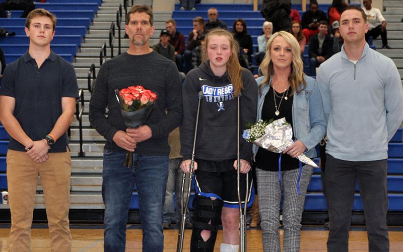 Eight Fannin County High School seniors were recognized at the Lady Rebels and Rebels last home game of the season Friday, January 31. Shown are, from left, Payton Holt, brother; Alan Holt, father; senior Lady Rebel Morgan Holt, Amber Holt, mother and Logan Holt, brother.