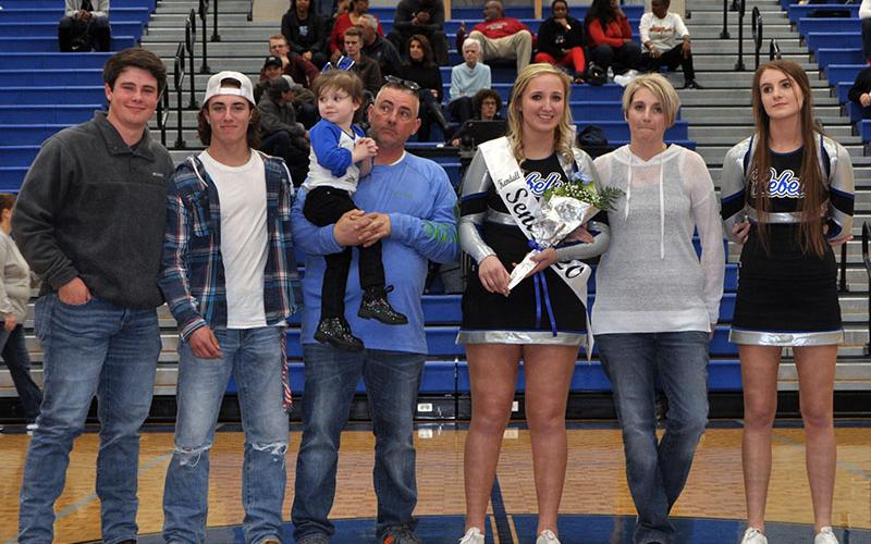 Eight Fannin County seniors were honored Friday, January 31, at Fannin County’s home basketball game against GAC. Shown are, from left, Matthew Postell, brother; Caleb Postell, brother; John Postell, father holding Kaylin Postell, sister; senior Kendall Postell, Stacey Postell, mother; and Anna Postell, sister.