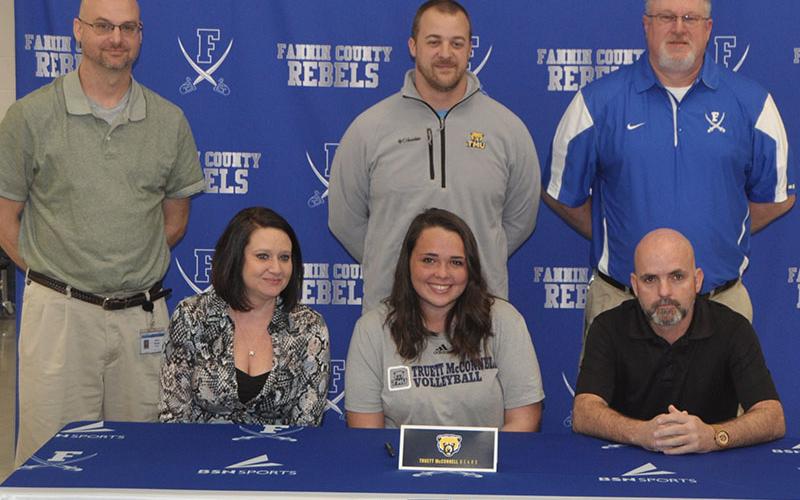 Lady Rebel Haley Parks chose to further her academic and volleyball career by signing a scholarship to go to Truett McConnell University Monday, February 3. Shown are, from left, front, Carie Lindsey, stepmother; Parks, Garrick Parks, father; and back, Fannin County head volleyball coach Jason Stanley, Truett McConnell volleyball head coach Mark Corbin, Fannin County junior varsity volleyball coach and varsity assistant Joe Breeden.