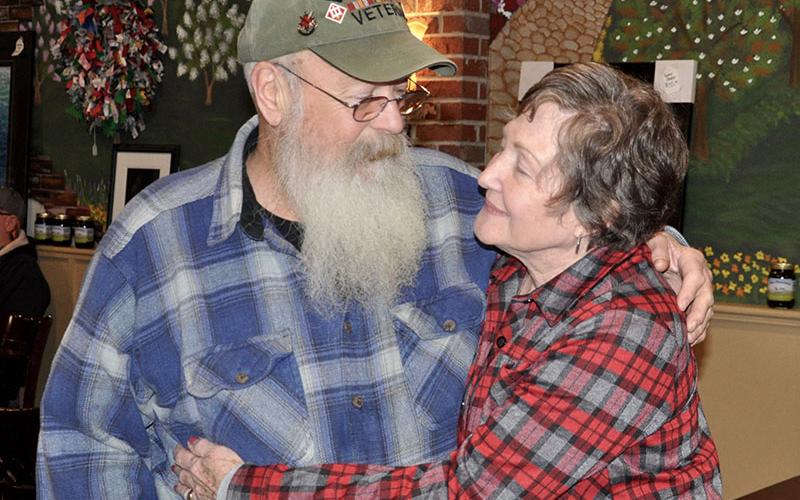 U.S. Army Vietnam Veteran Chuck Bowen III and wife Susie share an intimate moment after his being honored for his service Wednesday, January 29. Although Chuck goes out for breakfast every Wednesday, he was surprised when his wife decided to join him, but now he knows why she did.