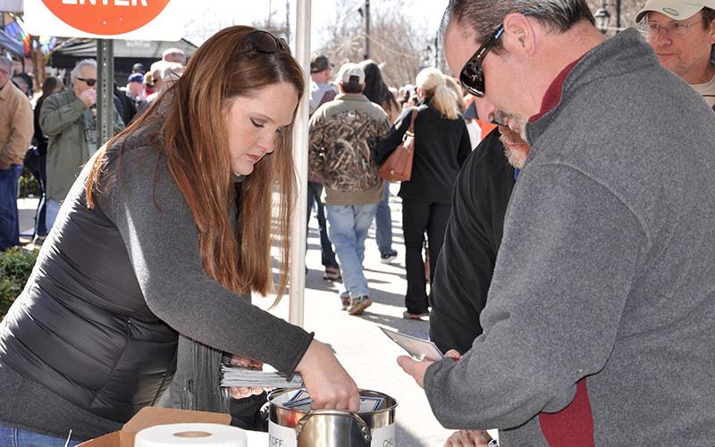 Erica Shirbroun gets a chili card for a patron during the weekend’s festival in downtown Blue Ridge.