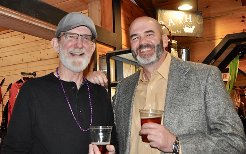 Ross DeLoach, left, and Bruce Thompson explored the silent auction section of Snack in a Backpack’s Bringin’ the Blues to Blue Ridge event. Local businesses and individuals donated a variety of items, tickets and gift certificates to help the organization raise money to decrease childhood hunger in Fannin County.