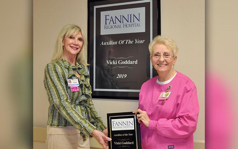Fannin Regional Hospital Auxiliary member Vicki Goddard, right, was named Auxilian of the Year for 2019. She was presented the award by Director of Volunteer Services Susan Kiker in front of a mounted version of the award that hangs in the halls of Fannin Regional Hospital along with other 2019 award recipients.
