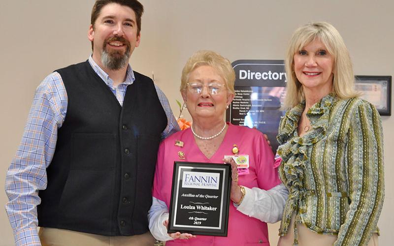 Louiza Whitaker, middle, was named Auxilian of the Quarter at Fannin Regional Hospital Auxiliary’s first quarterly meeting of the year. She is shown with Fannin Regional Hospital CEO Jason Jones and Director of Volunteer Services Susan Kiker.