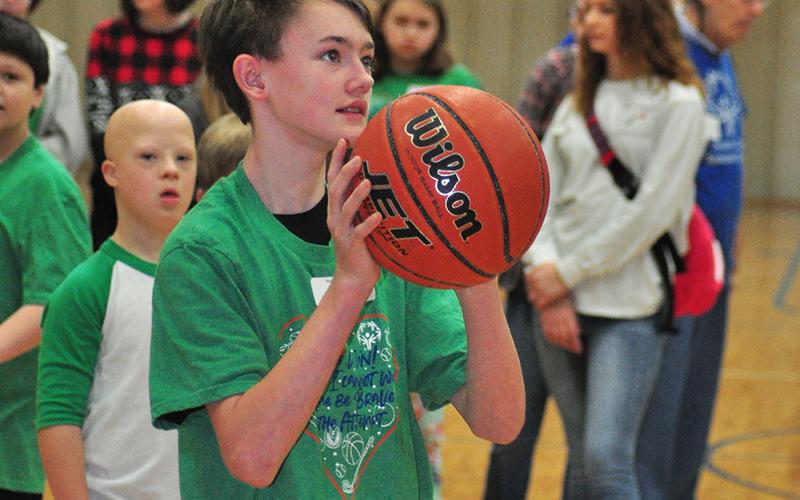 Matthew Marlowe sizes up the basket for a shot during Fannin County Special Olympics basketball competition at the Fannin County Recreation Center Friday, January 31.