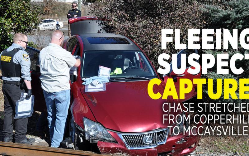 Polk County Deputy Manuel Patterson, left, and Detective Jake Wallace search the vehicle driven by Matthew Alexander Rich.