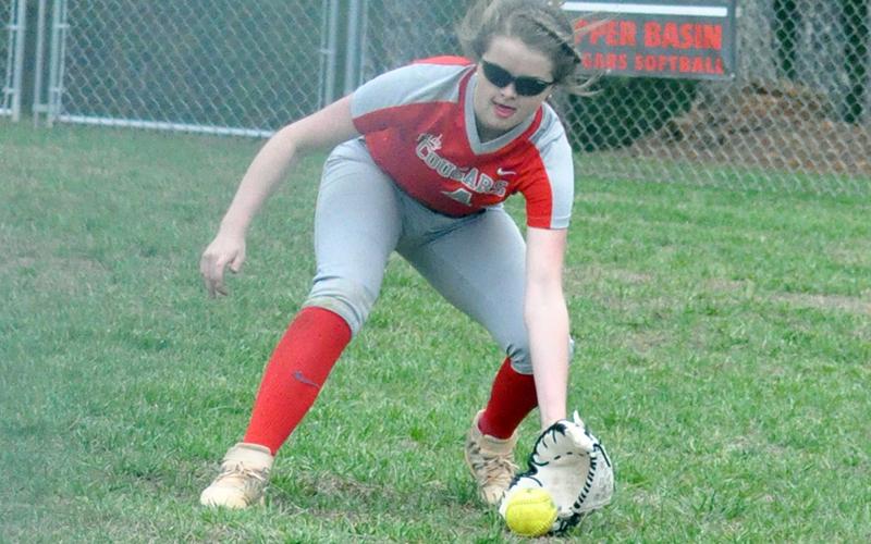 Lady Cougar Haley Harper scoops up a ground ball during the Lady Cougars first game of the season Monday, March 9.