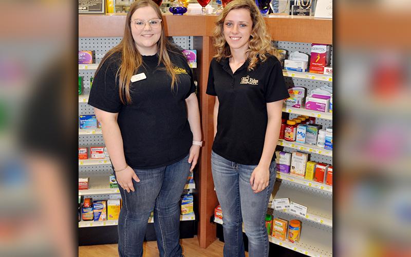 Fannin County High School seniors Hannah Ritchie, left and Ashton Davis take a break from working to smile for a photo. Ritchie and Davis help an Elderly female by going grocery shopping for her Thursday, March 26.