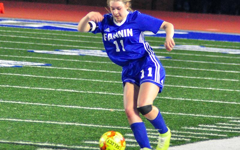 Lady Rebel Sydnie Jones keeps the ball away from a Dragonette defender during Fannin’s matchup with Pickens County Tuesday, March 3.