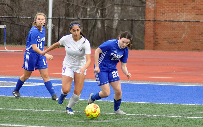 Lady Rebel Alyssa Goodwin chases down a defender for the ball in recent action for the Lady Rebels soccer team.