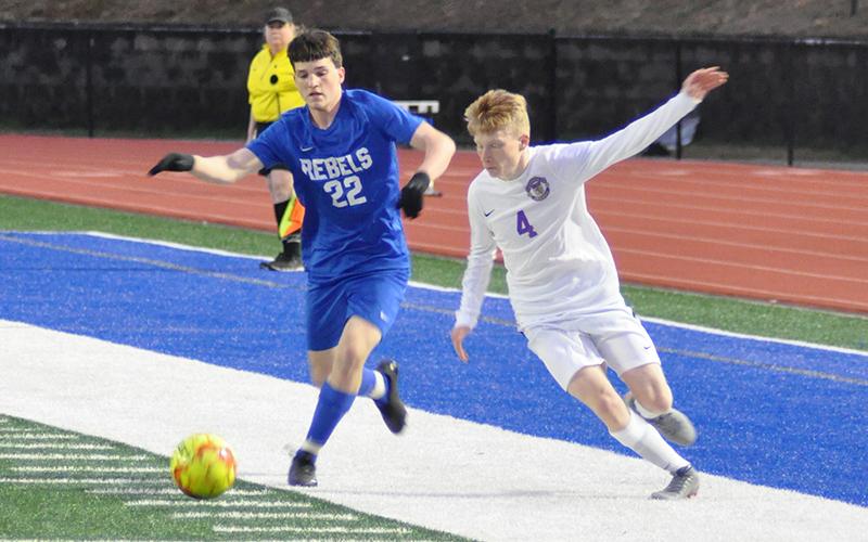 Fannin Rebel Garrett Mervine keeps the ball away from a defender in recent action for the Fannin County soccer team.