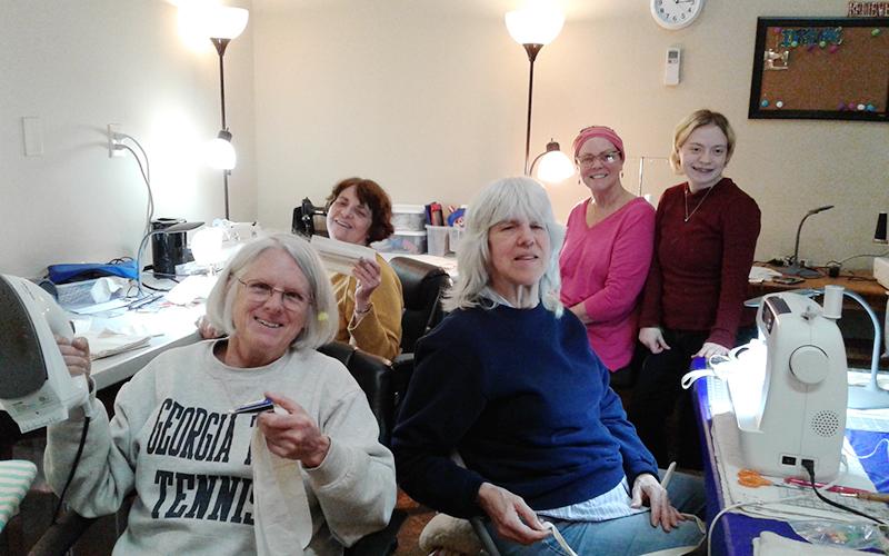 The Blue Ridge Community Theater “Costume Ladies” took initiative in sewing together masks to supplement the demand of N95 masks which deter airborne COVID-19 Monday, March 23. Helpers shown, from left, are Sue Hoagland, Pam Wilson, Deb Chavez, Renee Roberts and Olivia DeLoy.