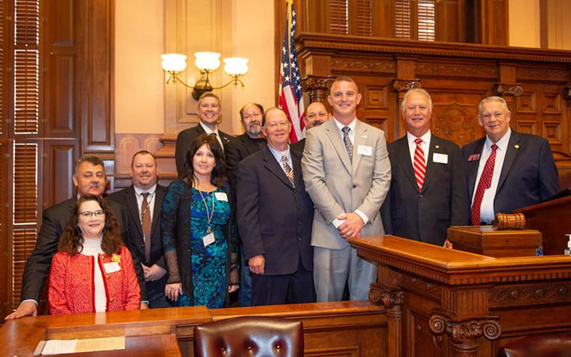 Members of the Fannin County Board of Education and school district leadership attended a legislative site visit day under the gold dome at Georgia’s capitol, where they were recognized in the House of Representatives by Speaker David Ralston Tuesday, February 3. Shown are, from left, front, board attorney Lynn Doss, Director of Achievement Sarah Rigdon, board members Bobby Bearden, Chad Galloway and Terry Bramlett, and Ralston; back, State Senator Steve Gooch, Assistant Superintendent Robert Ensley, Superi