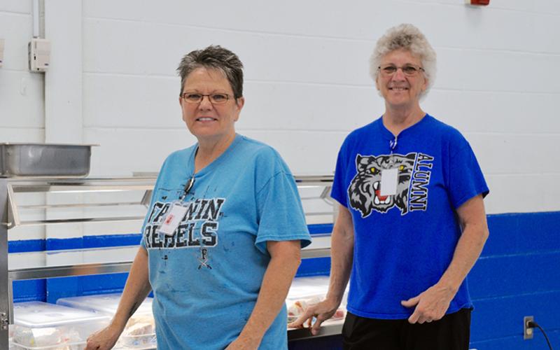 East Fannin Elementary School nutrition staff members Christy Sparks, left, and Yvonne Sams prepared meals for students who needed them during the school system’s closure due to COVID-19.