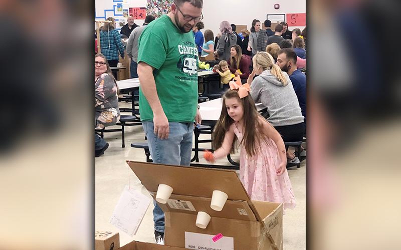 Blue Ridge Elementary School student Chloe Wishart and her father, Kevin Wishart, tested an arcade game that was built during STEAM classes and presented during the school’s annual STEAM Night Tuesday, March 10.