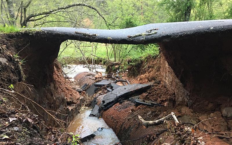 Only a small part of the road remained in the 1200 block of Damascus Road in Epworth Monday, April 13 after a log got into a pipe and washed out a portion of the road. Fannin County Public Works Director Zack Ratcliff said his department would receive the replacement pipe the following Thursday and be able to begin repair work the following Monday.
