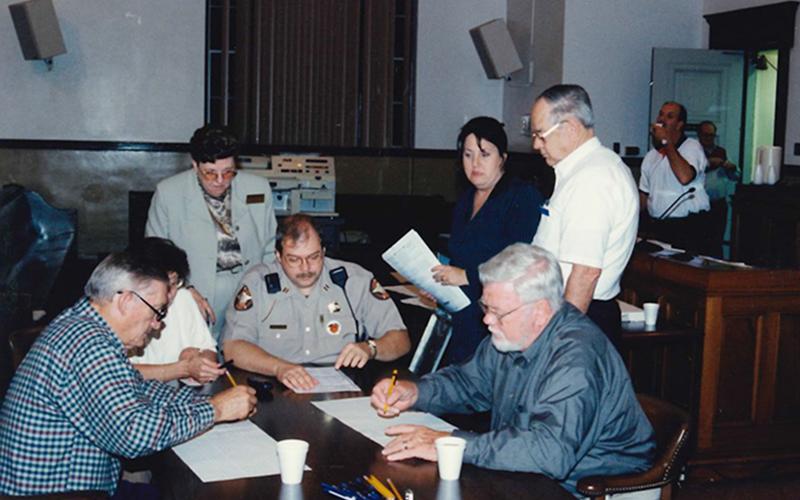 Blake Collins, Mary McDonald, Evelyn Panter, Winfred Cruse, Jammia Duvall, George Earley and Bill McDonald are shown, from left, working on an election day in Fannin County.