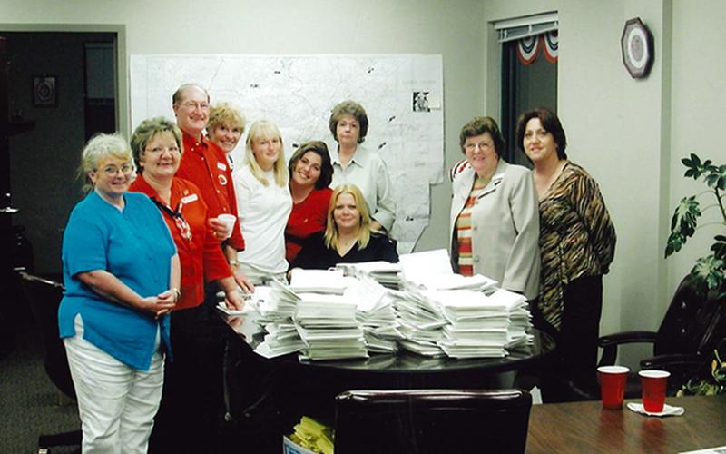 Fannin County Board of Elections staff are shown with a pile of voting related papers in 2004, the year of the big roll out of the touch screen voting units. Shown, from left, are Susan Byrum, Mary Ann Conner, Morris Queen, Lena Earley, Samantha Hill, Rachel Gray, Dorothy Davis, Cheryl Burns, Evelyn Panter and Jammia Duvall.