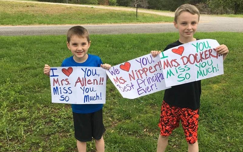 The teachers at Copper Basin Elementary School (CBES) couldn’t wait any longer to see their students, so they hoped in their vehicles and road around East Polk County waving and throwing candy to those who were waiting on them. Edward, left, and Robert Cole hold signs for their favorite teacher Wednesday, April 22, during CBES’s Teachers on the Town Parade.