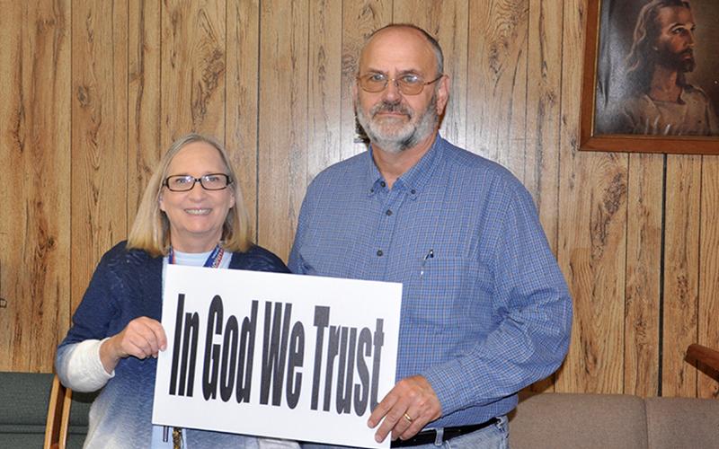Jan and Stewart Strickland hold a message from Appalachian Judicial Circuit District Attorney Alison Sosebee. The message is meant to provide a sense of hope to the community during these times.