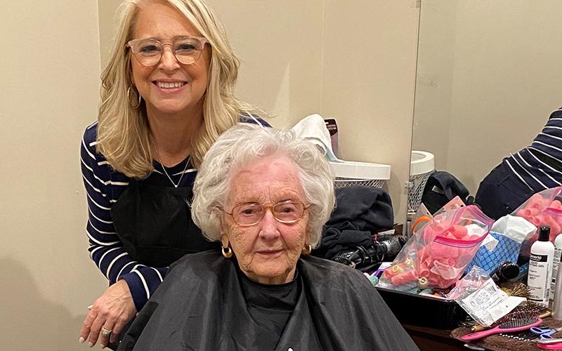 Blue Ridge Assisted Living &amp; Memory Care resident Maxine Ross enjoyed having her hair washed and styled by Senior Lifestyle Counselor Cindy Querry while her regular hair appointments have been put on hold due to COVID-19. Querry said she warned Ross that the job might not be as professional as the one she usually receives.