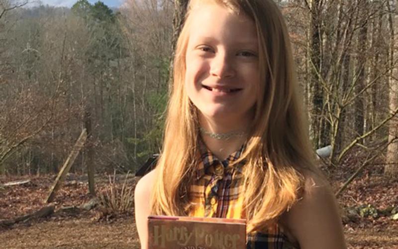 East Fannin Elementary School student Airianna Galloway is reading the entire Harry Potter series while she is home from school.