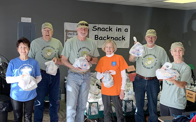 Members of the Marine Corps League Lake Blue Ridge Detachment 1438 assisted Snack in a Backpack by delivering 600 meals to three Fannin County elementary schools for distribution Thursday, April 2. Shown are, from left, Gail O’Neil, Marine Jeff O’Neil, Marine Dale Greene, Toots Greene, Marine Chuck Clark and Marine Dee Leuthe.