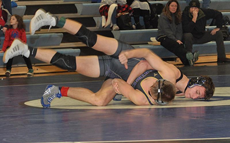 Fannin Rebel McCay Turner works his opponent in one of the Fannin County wrestling matching this past season.