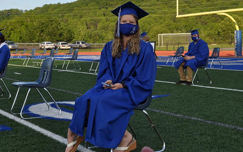 Fannin County graduate Peyton Peugh patiently waits for the Fannin County High School 2020 graduation to begin.