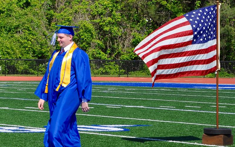 Zachary Nelson walks across Fannin County High School football field to receive his diploma during a private graduation ceremony Monday, May 11. The event was part of school officials’ plans to make graduation a memorable event for seniors amid COVID-19. A traditional ceremony is planned for May 22.
