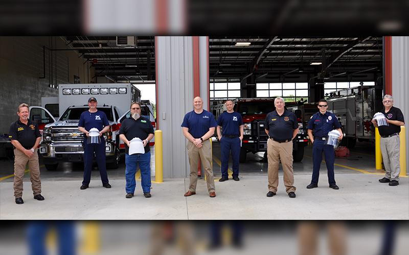 Wild Side, LLC. constructed protective hard hats for Fannin County Emergency Management Agency. The hard hats feature a shield that can be sanitized after each use and can be re-used. Shown are, from left, Fire Chief Larry Thomas, Paramedic Joey Cox, Wild Side, LLC. Owner Dale Evanson, Diamond Mobile Advertising Co-owner Justin Nicholson, Paramedic Dale Stiles, EMA Director Robert Graham, Firefighter Channing Johnston and EMA Deputy Director Darrell Payne.