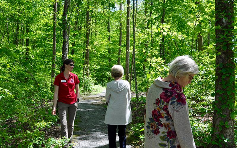 Taking a hike along Jane and Bill Whaley Mineral Springs Walking Trail are, from left, Fannin County Extension Agent Ashley Hoppers, North Georgia Master Gardeners Extension Volunteers (NGMGEV) President Fran Stoecker and NGMGEV Project Chair Alyce Wirtz.