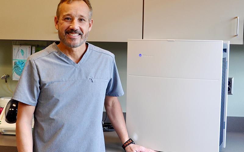 Mark Dlugokinski, DDS of Blue Ridge Dental shows off one of his HEPA air filters which is used to purify the air by capturing floating particles.