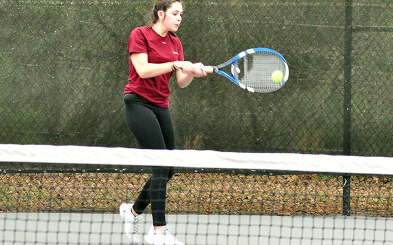 Lady Rebel tennis player Brook Patton keeps a volley alive in recent action for the Fannin County High School tennis team.