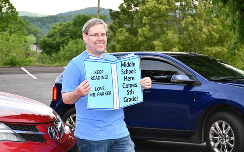 Blue Ridge Elementary School Media Specialist Ben Parker encourages fifth grade graduates to keep reading during the school’s Fifth Grade Drive-Thru Parade Tuesday, May 19.