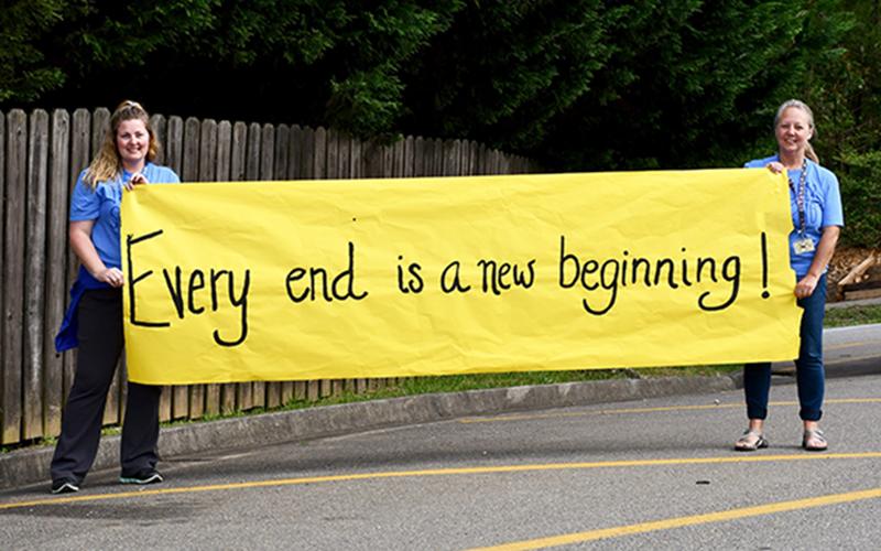 Blue Ridge Elementary School (BRES) Paraprofessionals Jill Pierce, left, and Crystal Walden remind their fifth grade students that while their final year at BRES has come to an end, they have a new beginning as they start middle school in the Fall.