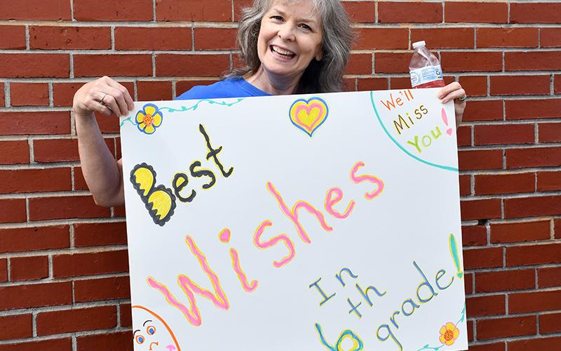 East Fannin Elementary School Paraprofessional Brenda Thomas sends her best wishes to the school’s graduating fifth grade students during the school’s Fifth Grade Parade Thursday, May 21. A similar event took place at Blue Ridge Elementary.