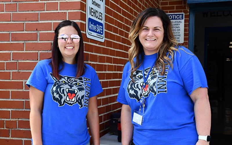 East Fannin Elementary School Pre-K Teacher Tessa Rogers, left, and Special Education Teacher Jenna Saxon take part in the school’s Fifth Grade Parade Thursday, May 22.