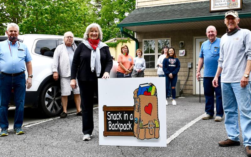 Snack in a Backpack volunteers packed lunches Wednesday, May 20. Among those packing were Executive Director Debby Beck, Mike Nunnally, Fred Wright, Gordon Riddoch, Tim May, Jeanie May, Bailey Mundy, Vicki Smith, Mary Kay Bailey, Mary Langford, Kirk Williams and Rev. Ron Wikander.