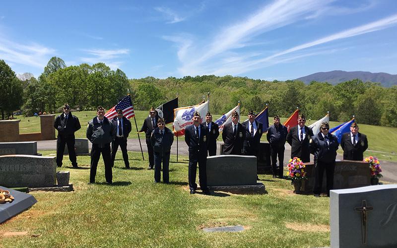 Members of the North Georgia Honor Guard conducted a Military Honors Ceremony for Garnett Webb at Crestlawn Cemetery Saturday, May 9. Shown are, from left, Nick Wimberley, Steve Strickland, Richard Crosley, Richard Pierce, Rev. James Galloway, Sonny Payne, Chris McKee, Bill Stodghill, Paul Hunter, Delos Horton, Ken Campbell, Cindy Gorton and Gerald McMillen.