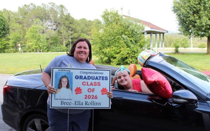 Copper Basin Elementary School teacher Jennifer Speights gives sixth grade graduate Bree-Ella Rollins her things during CBES’ sixth grade graduation Tuesday, May 26.
