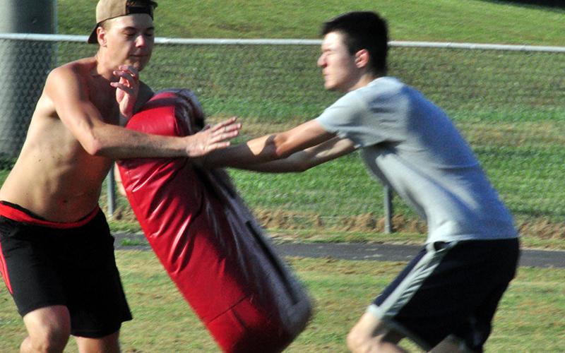 Timothy Fair fights through contact and runs his route during the Copper Basin Cougars football practice Thursday, June 4.