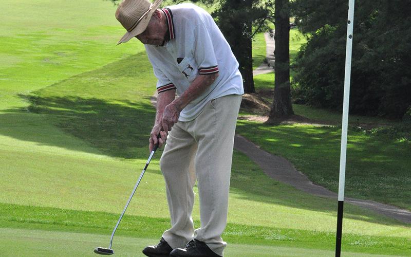 Dale Dyer putts the ball in the hole during Thursday’s golf match at the Copper Basin Golf Club June 11.